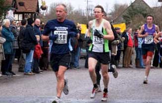 impression of runners through the village square
